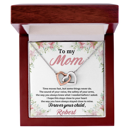 To My Mom Interlocking Hearts Necklace in polished stainless steel and rose gold finish shown in an open luxury gift box