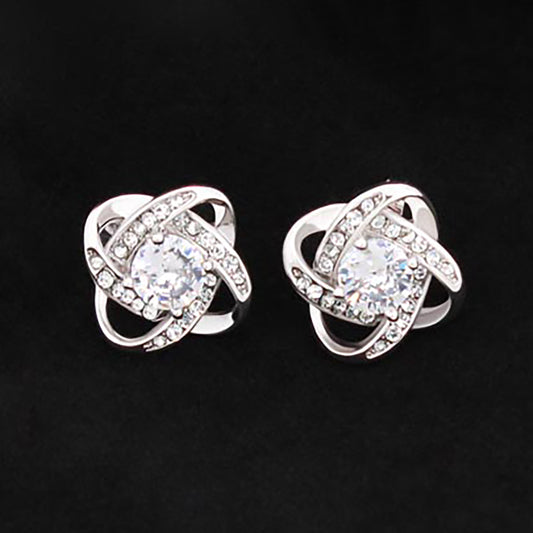 Love Knot Stud Earrings in 14K White Gold finish with cubic zirconia center stone